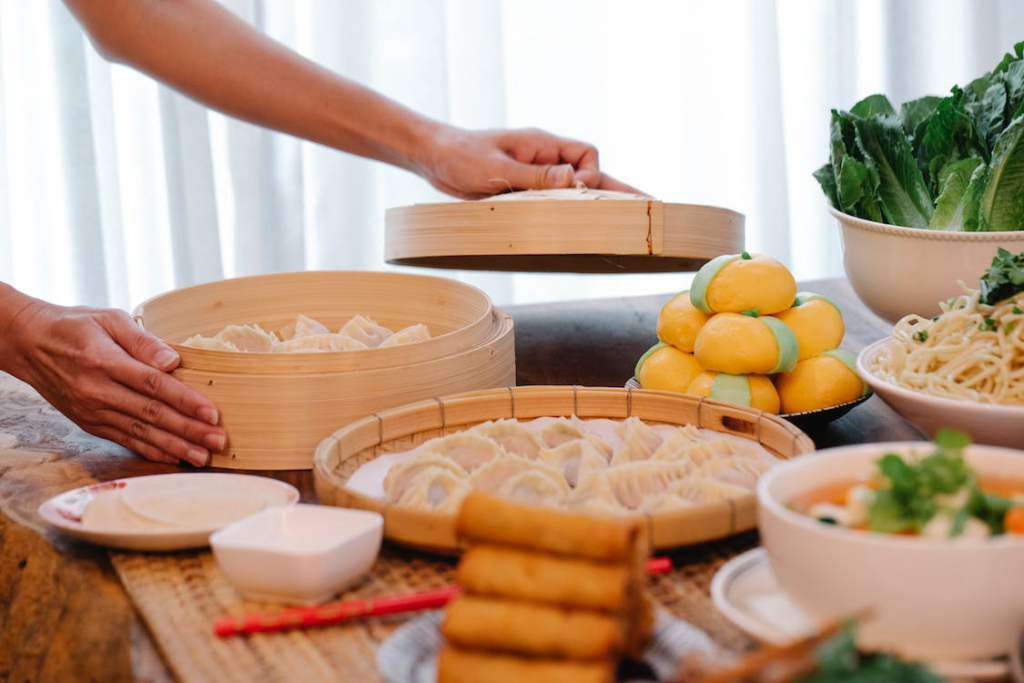 An assortment of dim sum dishes presented on bamboo steamers
